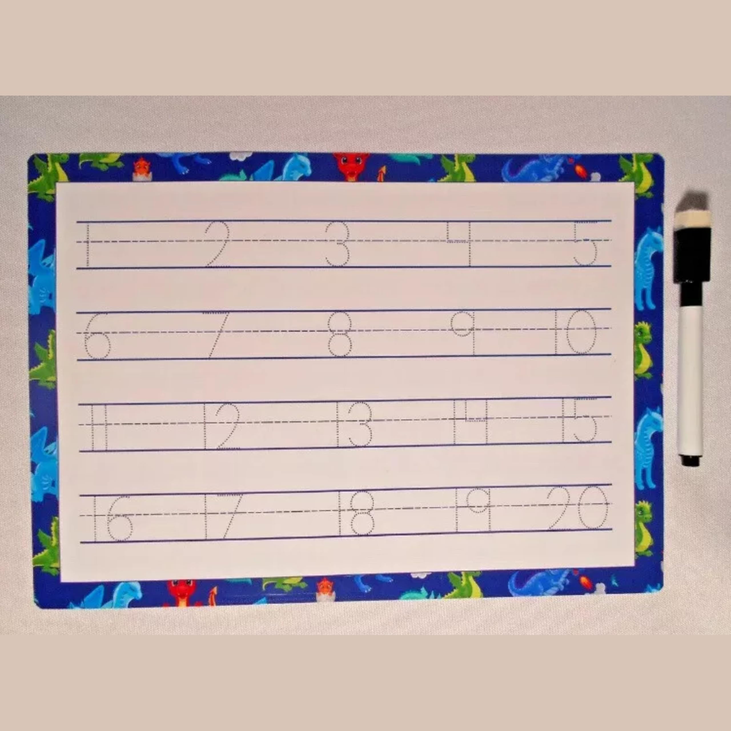 Alphabet, numbers & words tracing mats for kids, reusable tear-proof writing charts with a pen on a dinosaur-pattern mat.